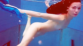 Redhead in blue bikini showing her body